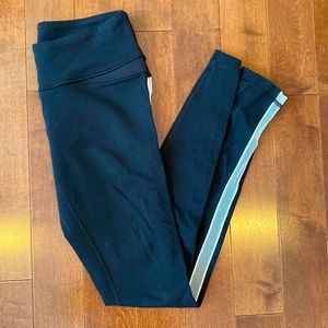 Black Lululemon Leggings with White Mesh Down the Sides